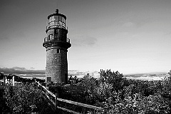 Wooden Fence Near Brick Tower of Aquinnah Lighthouse -BW